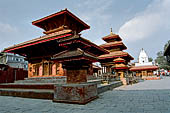 Kathmandu - Durbar Square. Jagannath temple (first from the left), the three levels roof Vishnu Temple, on the background the white spire of Kakeshwar temple. 