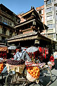 Kathmandu - from Asan Tole to Durbar Square. Lunchun Lunbun Ajima temple with erotic images on the roof struts.