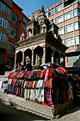 Kathmandu - Indra Chowk, the stairs of the Mahadev temple full of merchants.