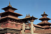 Patan Durbar Square - Taleju bell, behind on the background the large Dejutaleju temple and the Taleju temple of the Royal Palace. 