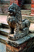 Patan Durbar Square - lion statue in front of the sikkara temple dedicated to Narisingha.