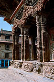 Patan Durbar Square - Temple of Vishwanath, detail of the wood carvings of the pillars of the facade.