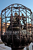 Patan - South of Durbar Square, the temple of Rato Machhendra Nath,  symbols of the Tibetan calendar on top of pillars.
