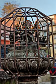 Patan - South of Durbar Square, the temple of Rato Machhendra Nath,  symbols of the Tibetan calendar on top of pillars.