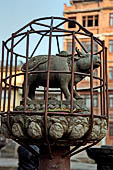 Patan - South of Durbar Square, the temple of Rato Machhendra Nath,  symbols of the Tibetan calendar on top of pillars.