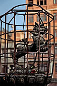 Patan - South of Durbar Square, the temple of Rato Machhendra Nath,  symbols of the Tibetan calendar on top of pillars.