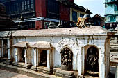 Swayambhunath Stupa - Cluster of thirty-four votive caityas of various types nearby the statue of the Buddha of light.