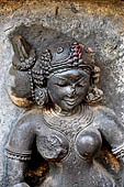 Hirapur - the Sixtyfour Yoginis Temple, head detail of Yogini n 24 (clockwise). Her braid is on the right and she is wearing a mukuta. 