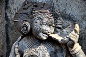 Hirapur - the Sixtyfour Yoginis Temple, detail of the head of Yogini n 3 (clockwise) drinking from a skull cup. 