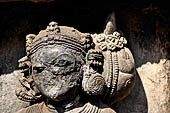 Hirapur - the Sixtyfour Yoginis Temple, head detail of Yogini n° 49 (clockwise), note the large braid to the left of her head. 