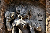 Hirapur - the Sixtyfour Yoginis Temple, head detail of Yogini n° 42 (clockwise) with a damaru on her right hand. 