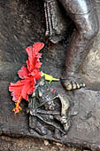 Hirapur - the Sixtyfour Yoginis Temple, detail of the pedestal of Yogini n 32 (clockwise) with an archer with a bow and arrow. 