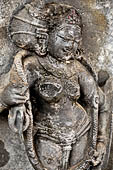 Hirapur - the Sixtyfour Yoginis Temple, Yogini n 29 (clockwise) wearing a garland of snakes and holding a vajra. 