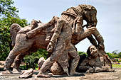 Orissa - Konarak - The Sun Temple. The war horses statues guarding the north staircase leading to the jagamohan.