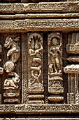Konarak - Orissa. The Sun Temple, decoration with nagakanya motif of the platform of the jagamohana-deul complex.