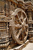 Konarak - Orissa. The Sun Temple, detail of one of the twelve pairs of the great wheels arrayed along the platform.  