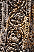 Konarak - Orissa. The Sun Temple, details of the twelve pairs of the great wheels arrayed along the platform. 