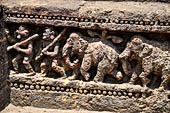 Orissa - Konarak - The Sun Temple. The frieze which runs continously all  around the base of the temple platform, decorated with more than ten thousands elephants . 