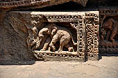 Orissa - Konarak - The Sun Temple. The frieze which runs continously all  around the base of the temple platform, decorated with more than ten thousands elephants . 