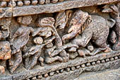 Orissa - Konarak - The Sun Temple. The frieze which runs continously all  around the base of the temple platform, decorated with more than ten thousands elephants . 