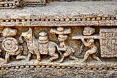 Orissa - Konarak - The Sun Temple. The frieze which runs continously all  around the base of the temple platform, decorated with more than ten thousands elephants . 
