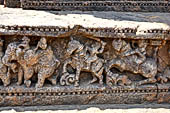 Orissa - Konarak - The Sun Temple. The frieze which runs continously all  around the base of the temple platform, decorated with more than ten thousands elephants . 