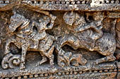 Orissa - Konarak - The Sun Temple. The frieze which runs continously all  around the base of the temple platform, decorated with more than ten thousands elephants . 