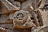Konarak - Orissa. The Sun Temple, details of the twelve pairs of the great wheels arrayed along the platform. 