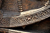 Konarak - Orissa. The Sun Temple, details of the twelve pairs of the great wheels arrayed along the platform. 