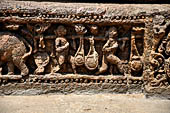 Orissa - Konarak - The Sun Temple. The frieze which runs continously all  around the base of the temple platform, decorated with more than ten thousands elephants . 