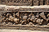 Orissa - Konarak - The Sun Temple. The frieze which runs continously all  around the base of the temple platform, decorated with more than ten thousands elephants . 