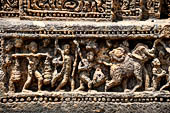 Orissa - Konarak - The Sun Temple. The frieze which runs continously all  around the base of the temple platform, decorated with more than ten thousands elephants . 