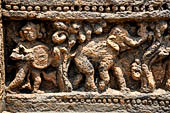 Orissa - Konarak - The Sun Temple. The frieze which runs continously all  around the base of the temple platform, decorated with more than ten thousands elephants . 