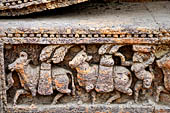 Orissa - Konarak - The Sun Temple. The frieze which runs continously all  around the base of the temple platform, decorated with more than ten thousands elephants . 