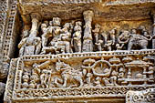 Konarak - Orissa. The Sun Temple, relief  of the platform showing an important personage delivering a discourse to nobleman with their horses and elephants shown below the pavillon.