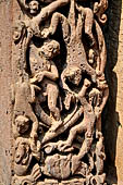 Orissa - Bhubaneshwar. Mukteswara temple, the large latticed window on the side of the jagmohana with all around figurines of lice-picking monkeys.