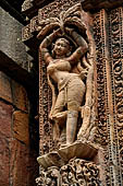 Orissa - Bhubaneswar. Rajarani temple, sculpture of alasa kanya (indolent maiden) in languid and alluring poses. 