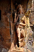 Orissa - Bhubaneswar. Udaigiri, Cave n4, female figure with a parrot at the side of the entrance cell.