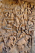 Udaigiri Cave 1 Rani Gumpha Queen's Cave - southern pavilion, decorations of the west wall representing hill, rocks and forest with fruit trees and elephants enjoying a bath.