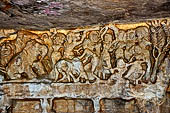 Udaigiri Cave 1 Rani Gumpha Queen's Cave - friezes of the upper storey. The story of a Kalinga queen carried away by Ashoka after the Kalinga battle. The second tableau with three elephants fighting with a group of persons. 