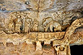 Udaigiri Cave 9 - the relief of the worshipping of the legendary Kalinga Jaina symbol. The figure wearing a crown (second from the left) is thought to be the Chedi king, Vakradeva, the donative inscription can still be seen close by.  