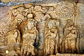 Udaigiri Cave 9 - the relief of the worshipping of the legendary Kalinga Jaina symbol. The figure wearing a crown (second from the left) is thought to be the Chedi king, Vakradeva, the donative inscription can still be seen close by.  