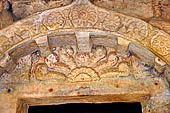 Khandagiri hill, Tatowa Gumpha n.2  the 'Parrot Cave', doorway decoration filled with a garland. 