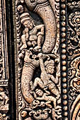 Udayagiri - Monastery n1. Decoration detail of the richly carved doorframe of the sanctum. Climbing acrobats.