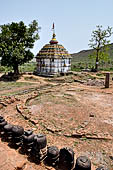 Udayagiri - Udayagiri II escavations. Small portable stupas, In the background the Hindu temple.