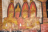 Dambulla cave temples - Cave 3, Maha Alut Viharaya (Great New Temple), paintings of the ceiling show the future Buddha, Maitreya, preaching in a Kandyan-looking pavilion to a group of splendidly adorned gods. 