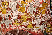 Dambulla  - Cave 2 Maharaja Vihara (Temple of the Great Kings) panels of the Defeat of Mara: Buddha is seated in bhumisparsha mudra (calling earth to witness) whilst demons attack him led by Mara  on elephant. 