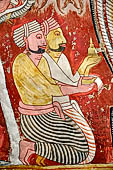Dambulla cave temples - Cave 2, Maharaja Vihara (Temple of the Great Kings) detail of the figures below the panels of the Mara Parajaya (Defeat of Mara). 