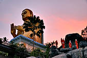 Dambulla cave. The Golden Temple at the site entrance. 30m-high Buddha image in the dhammachakra mudra (dhamma-turning pose). 
