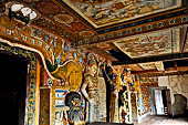 Mulkirigala cave temples - Third terrace. The entrance to the Aluth Viharaya cave. Dragon Arch decorations.